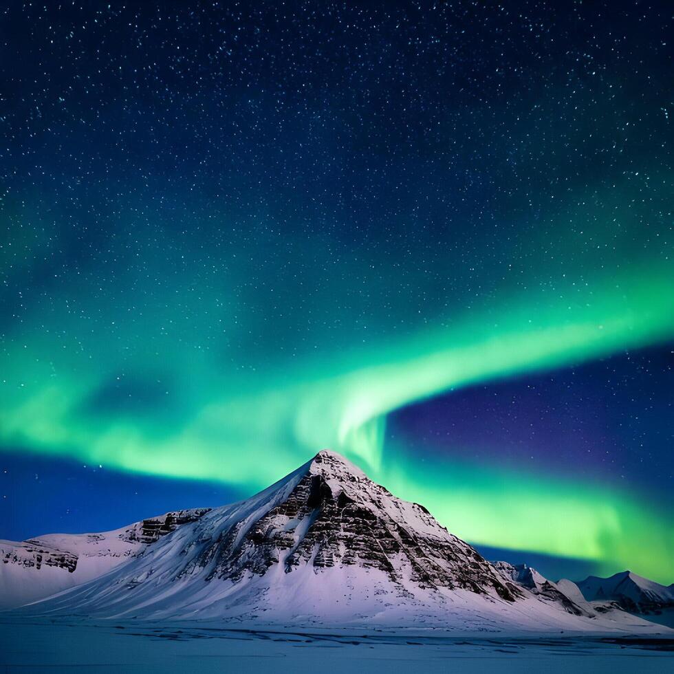 Vibrant Aurora Borealis over Snowy Mountain at Night photo