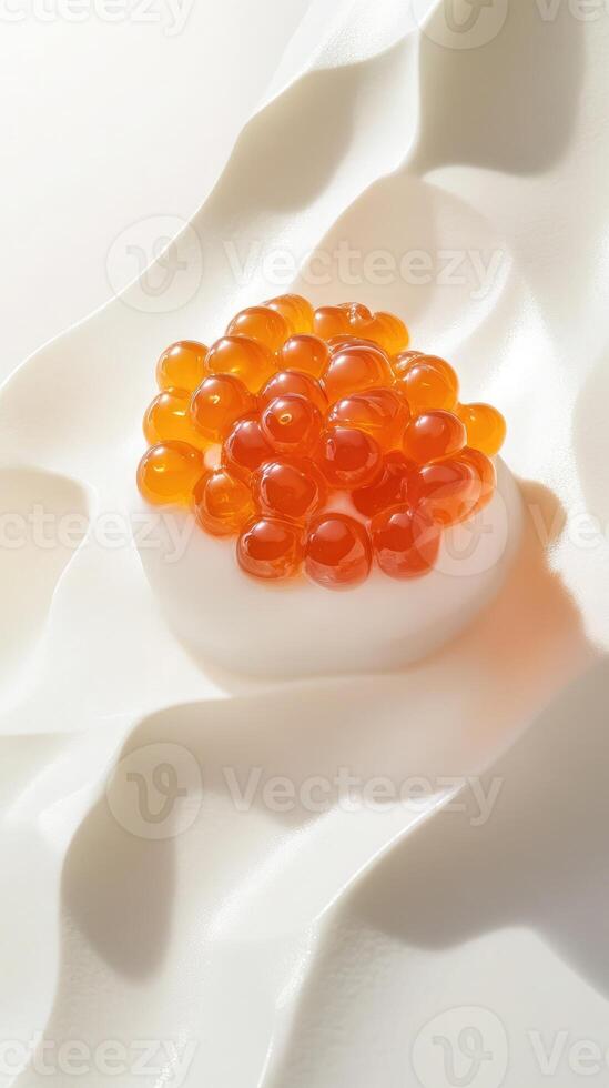 Captivating orange Osetra caviar balances on porcelain with verbena-infused foam ripples photo