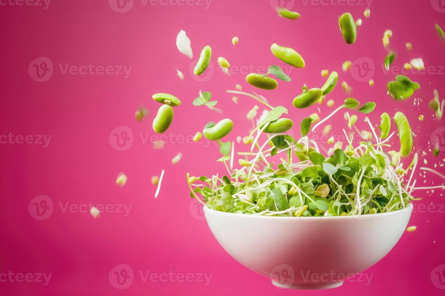 Vibrant microgreens and edamame beans captured in motion against a bold pink backdrop photo