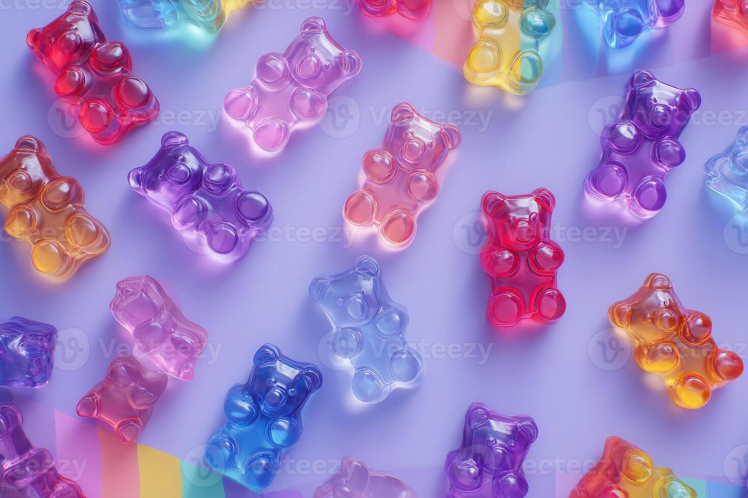 Brightly colored gummy bears in shades of red, purple, pink, and yellow are spread across a light pastel surface, complemented by a vibrant rainbow ribbon. A playful arrangement evokes sweetness. photo
