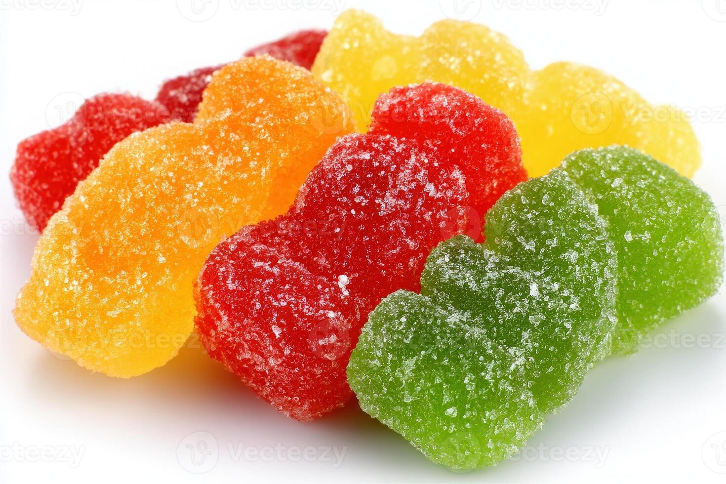 A vibrant collection of gummy bear candies in assorted colors including red, yellow, green, and orange. Each piece is coated in sugar, showcasing their chewy texture and fruity flavors. photo