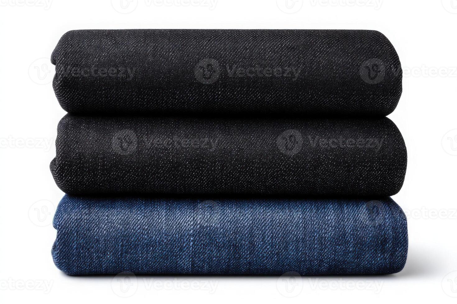This display features three neatly rolled pieces of denim fabric in various shades. photo