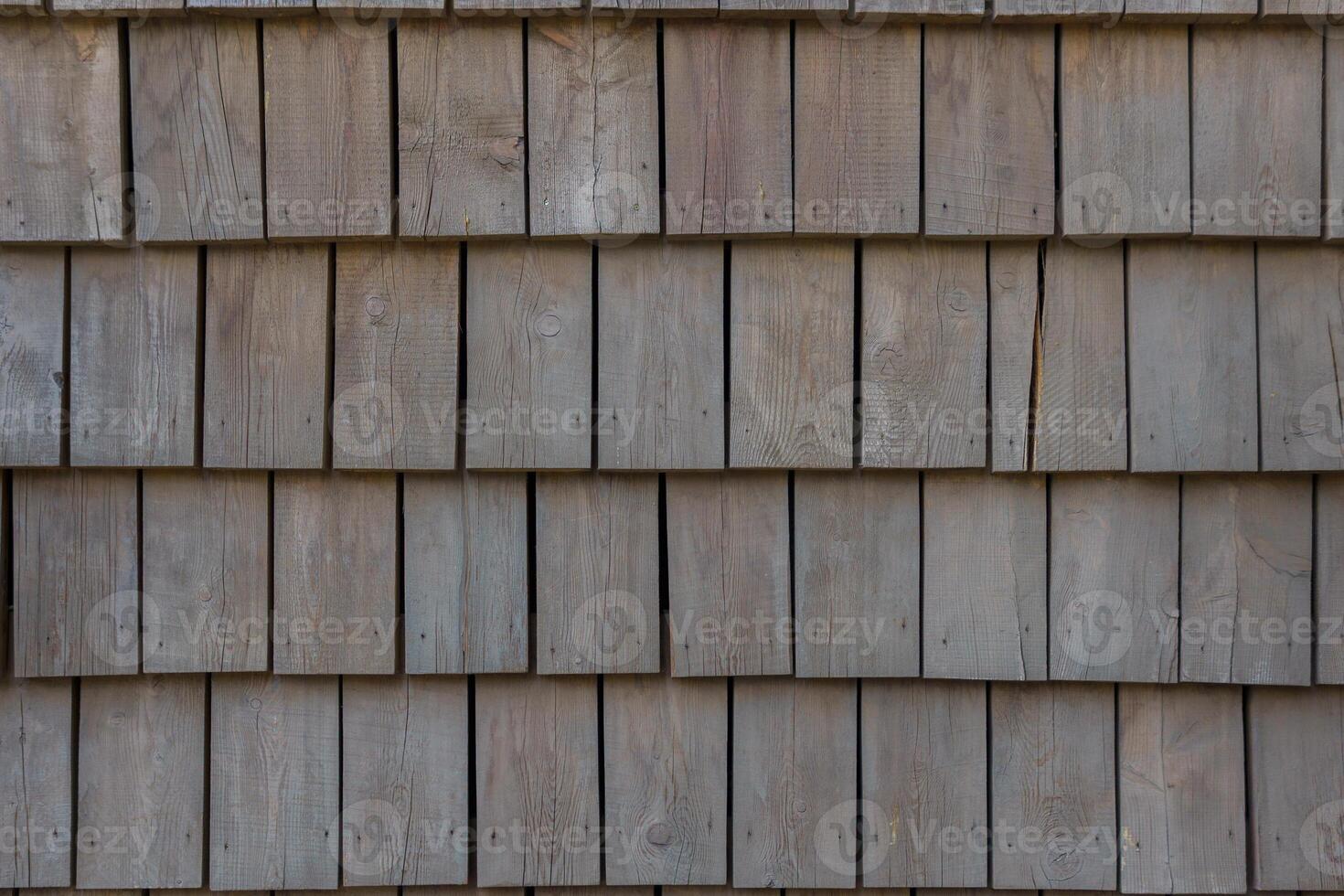 Wall of wooden shingles. Beautiful pattern of squares. photo