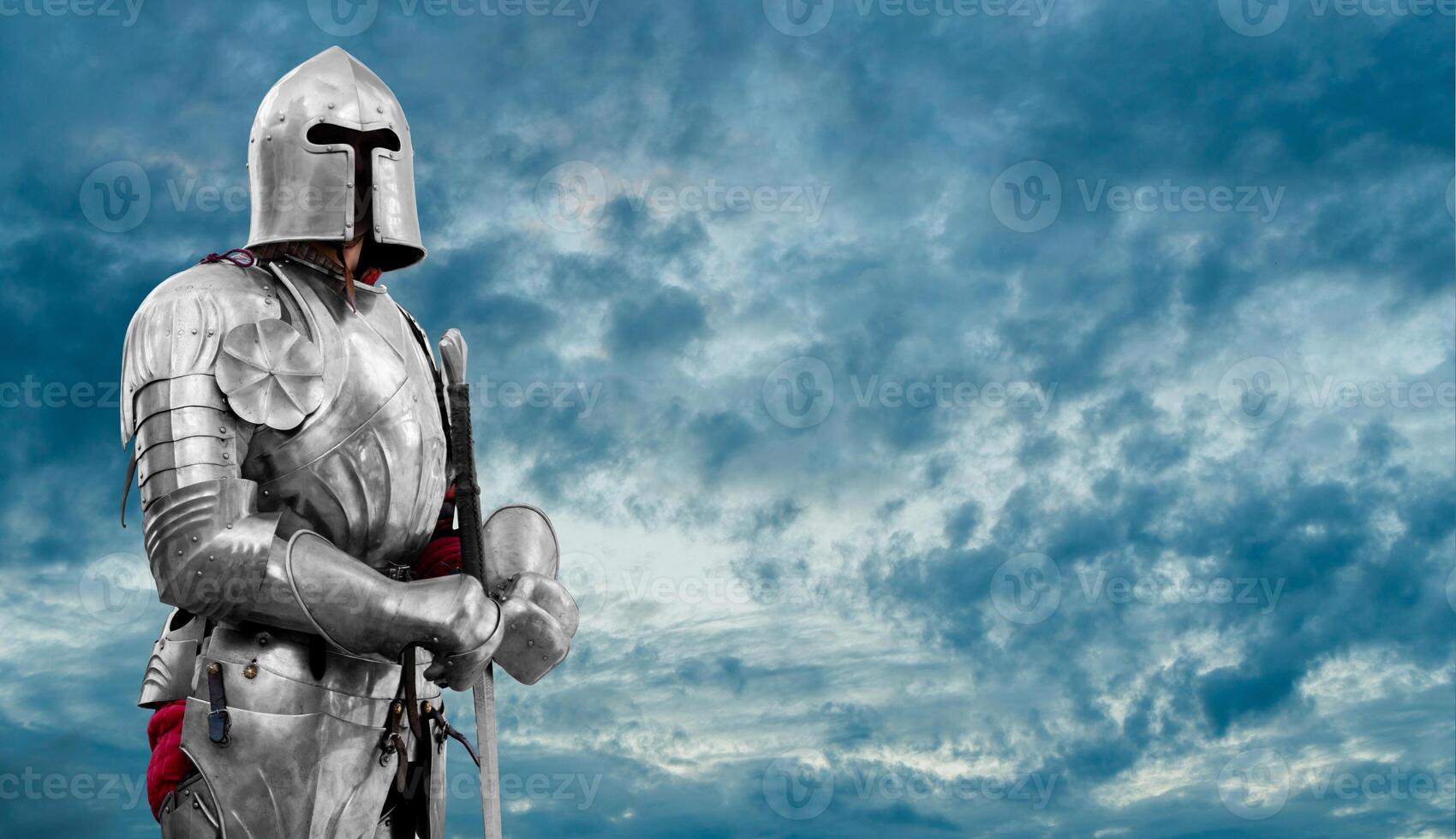 Knight in shiny metal armor. Reliable security and insurance. . photo
