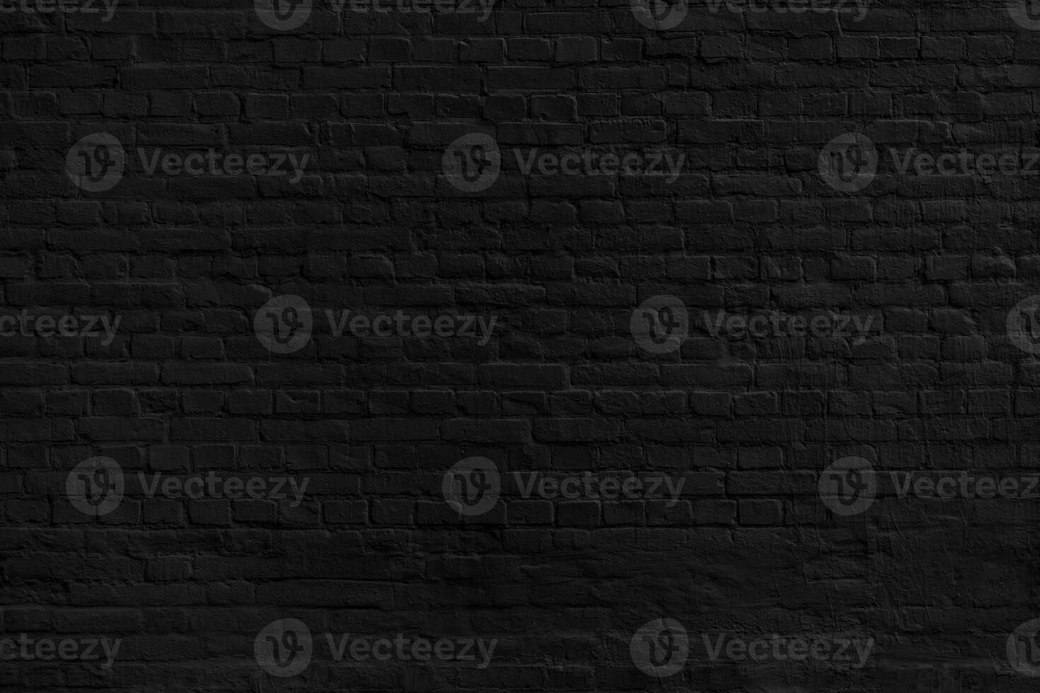 Mysterious black brick wall. The background of the old black brick wall for design interior and various scenes or as a background for interviews. photo