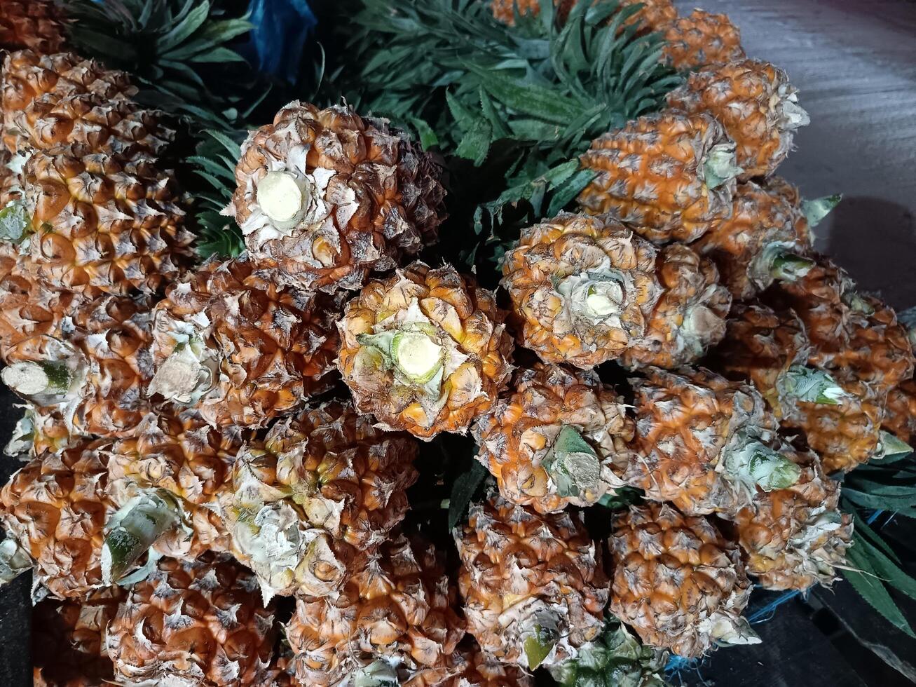 pineapples are arranged in a basket on a table photo