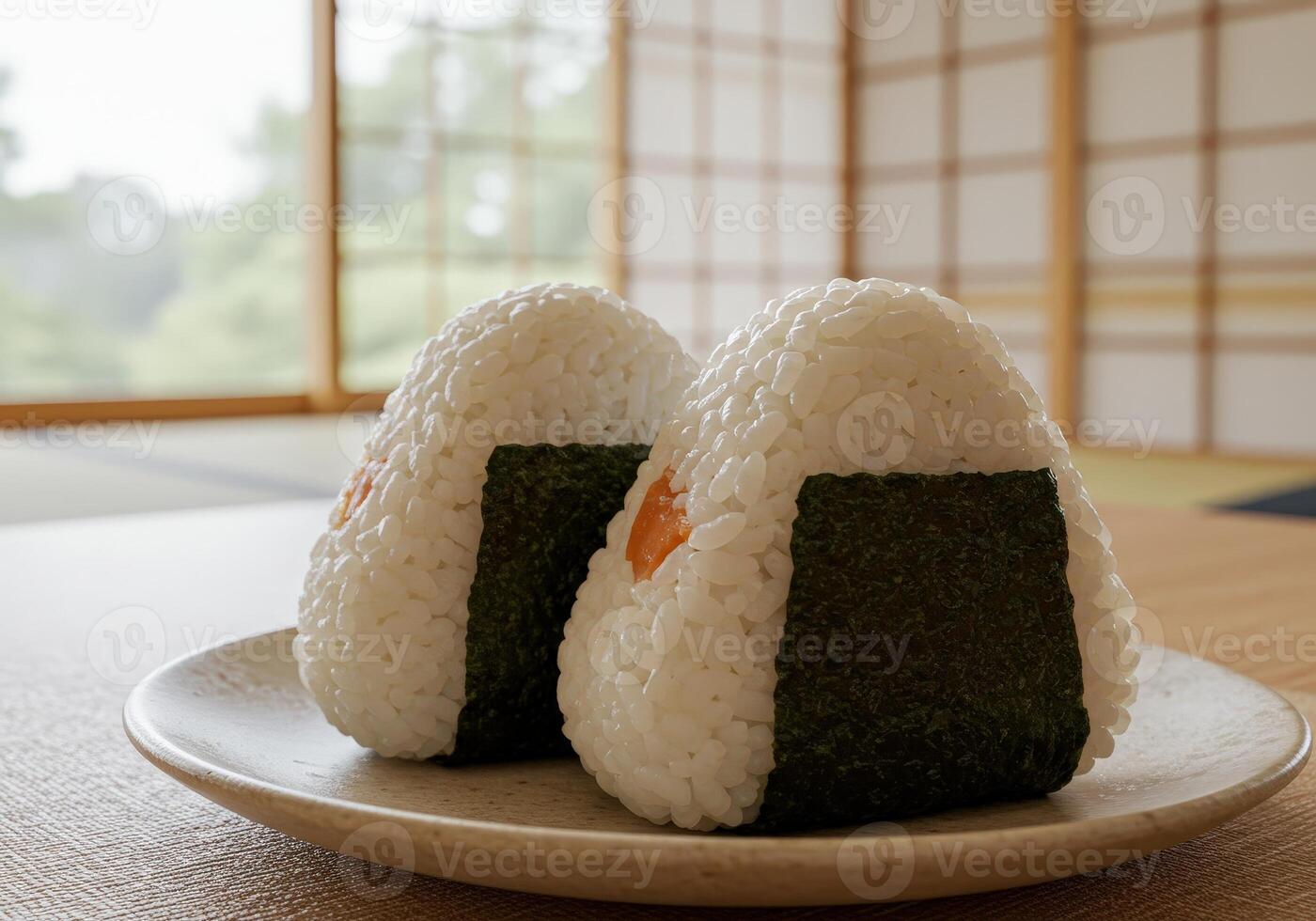 Delicious Japanese Onigiri rice balls with seaweed. Served on plate photo