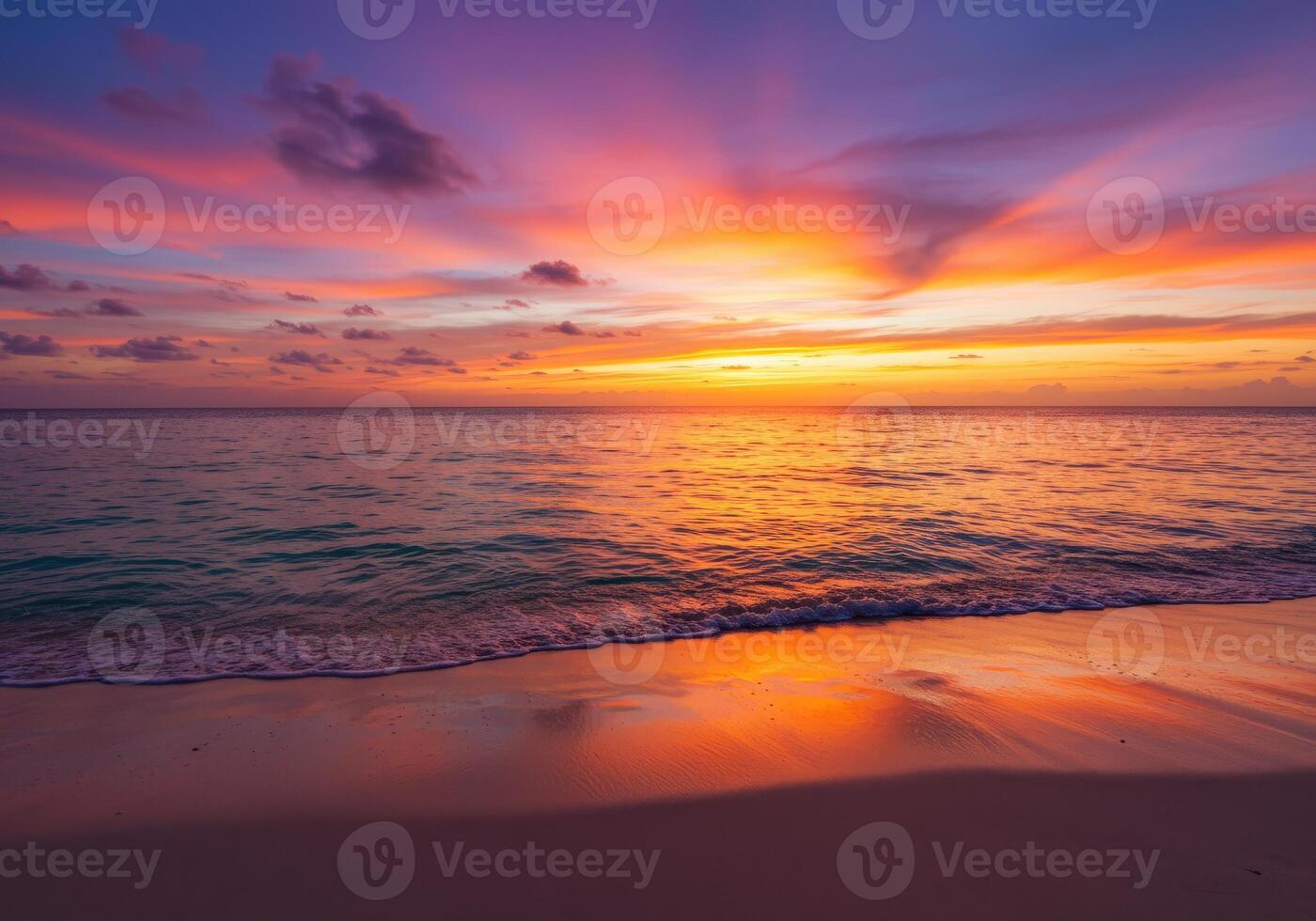 Vibrant sunset over a tranquil tropical beach with colorful sky and ocean reflections photo