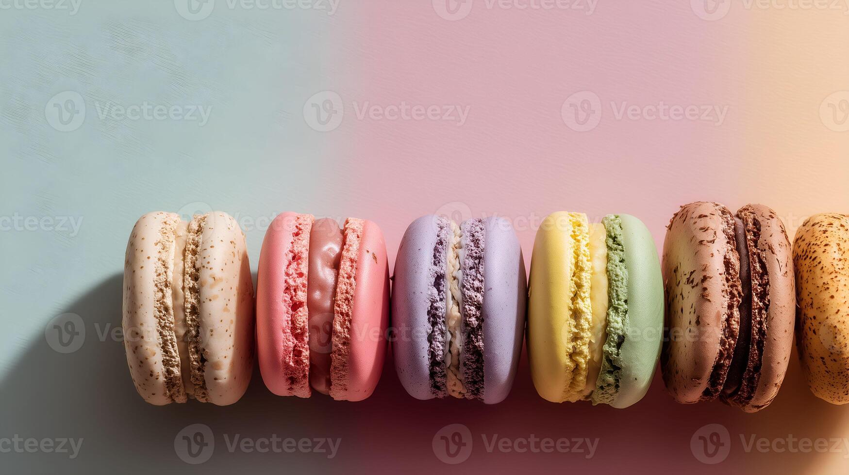 Colorful French macarons on a pastel background. Food photography with soft shadows and clean space for text. photo