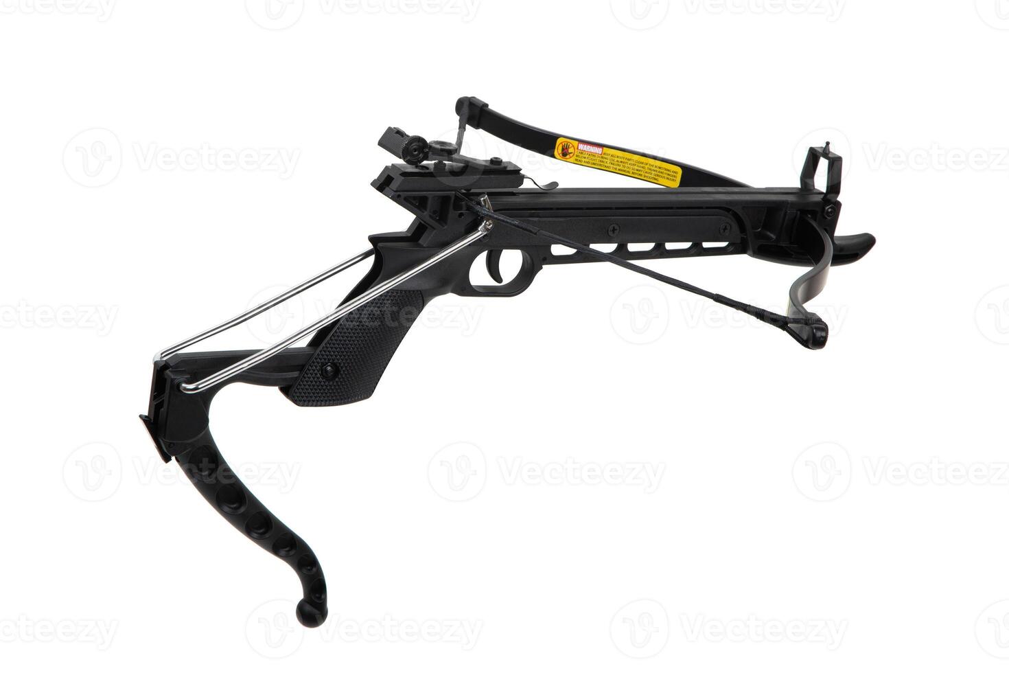 Black pistol crossbow with tensioned string and metal stirrup, isolated on white back photo