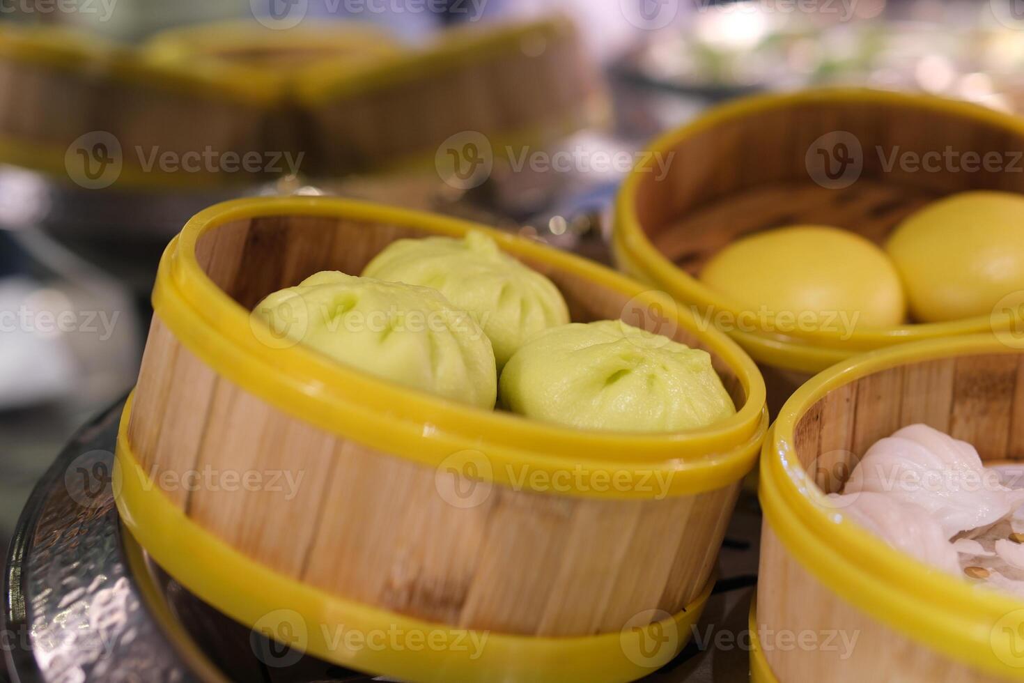 Various of dim sum on wooden steamer close-up macro. Steaming Technique. Chinese dessert food. Dimsum with shrimps, fish and meat. Dish in a cafe. Homade. Delivery photo