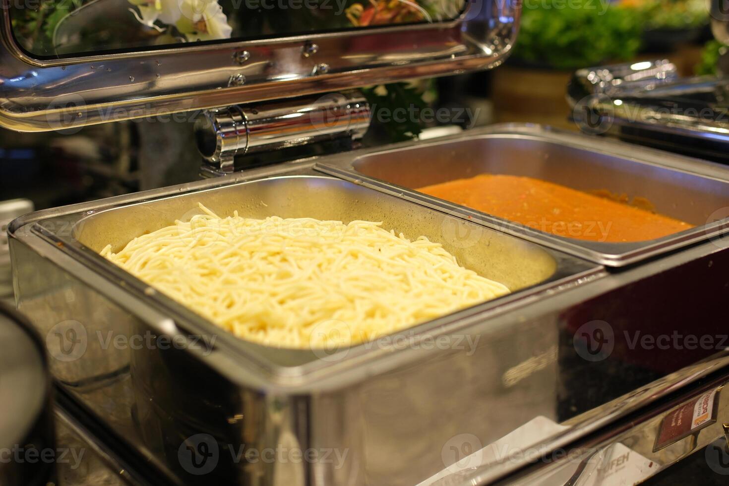 Pasta sauce container spaghetti pasta with red tomato sauce on a fork in box take away. Delicious Italian food delivery. selective focus. photo