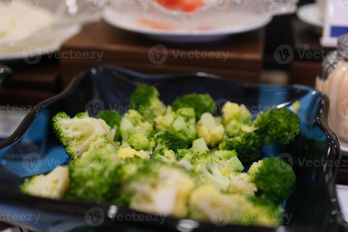 Broccoli, cooking in pan, green vegetables boiling in a pan. Healthy boiled vegetables photo