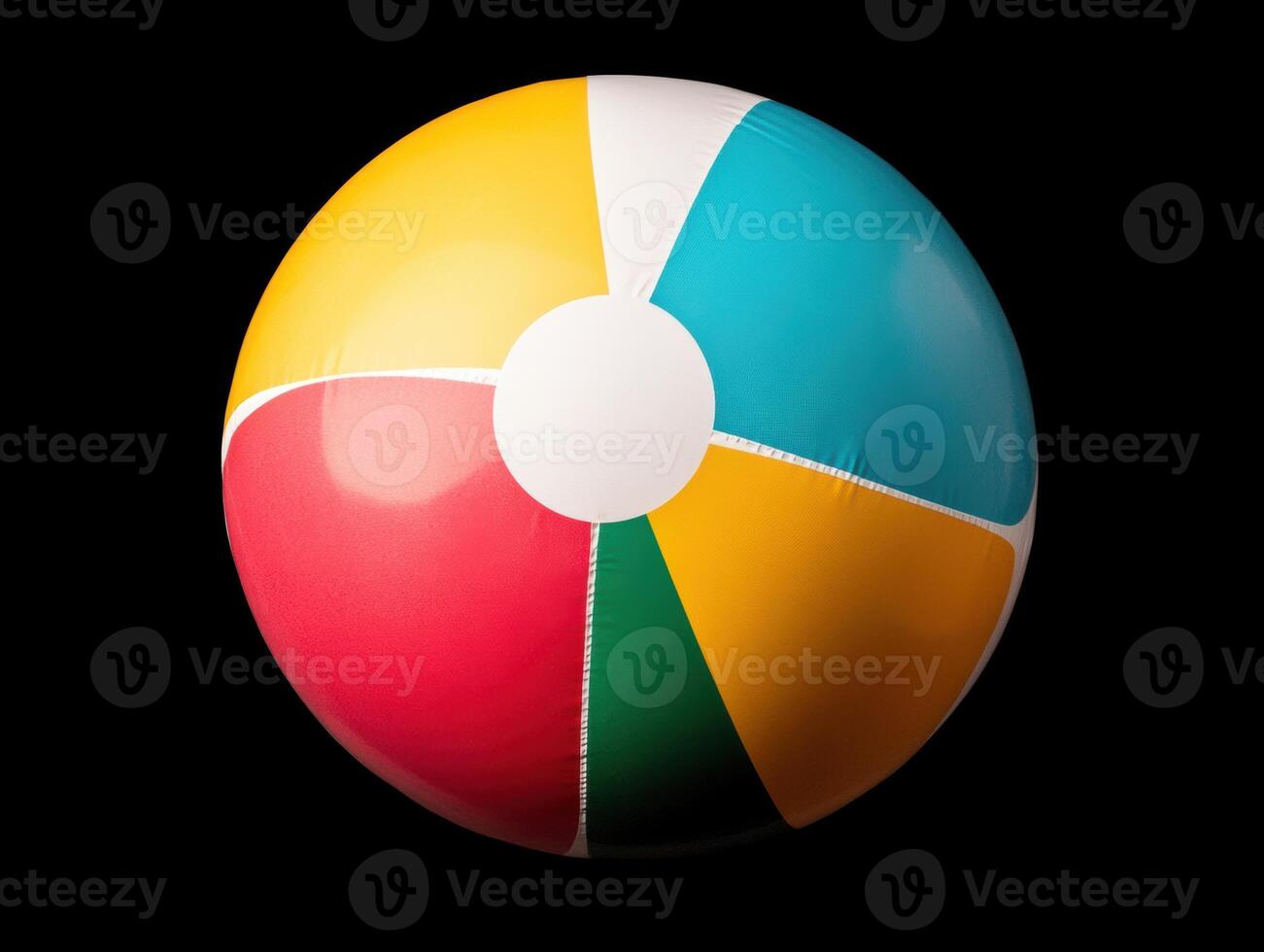 Colorful beach ball resting against a black background photo