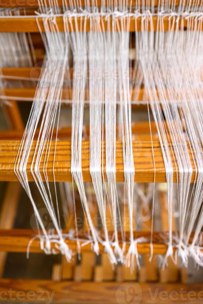 Vintage silk weaving machine, cultural textile industry photo