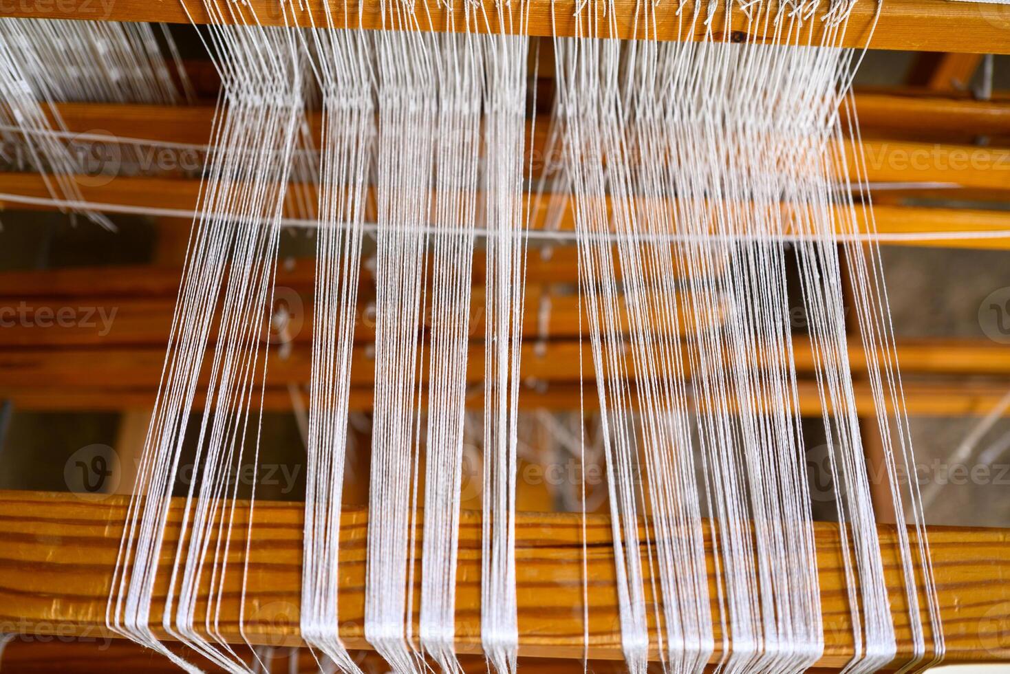 Textile craftsmanship, antique silk weaving loom. close up view photo