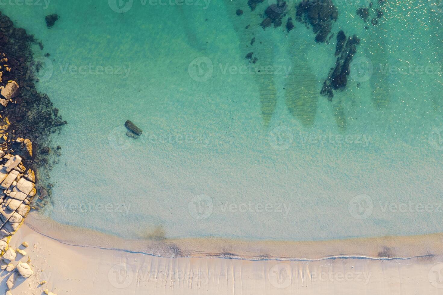 turquoise and transparent water of the sea on the shore of a beach in Rias Baixas, Galicia. Spain, Aerial drone top view photo
