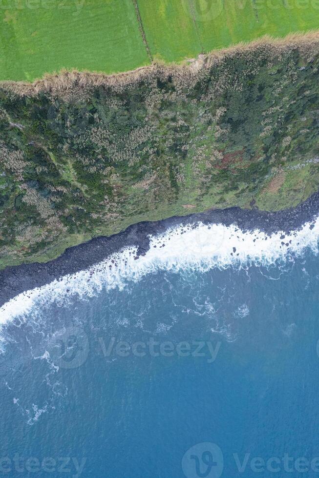 aerial top down drone image of a cliff on the north coast of the island of Sao Miguel. Azores photo