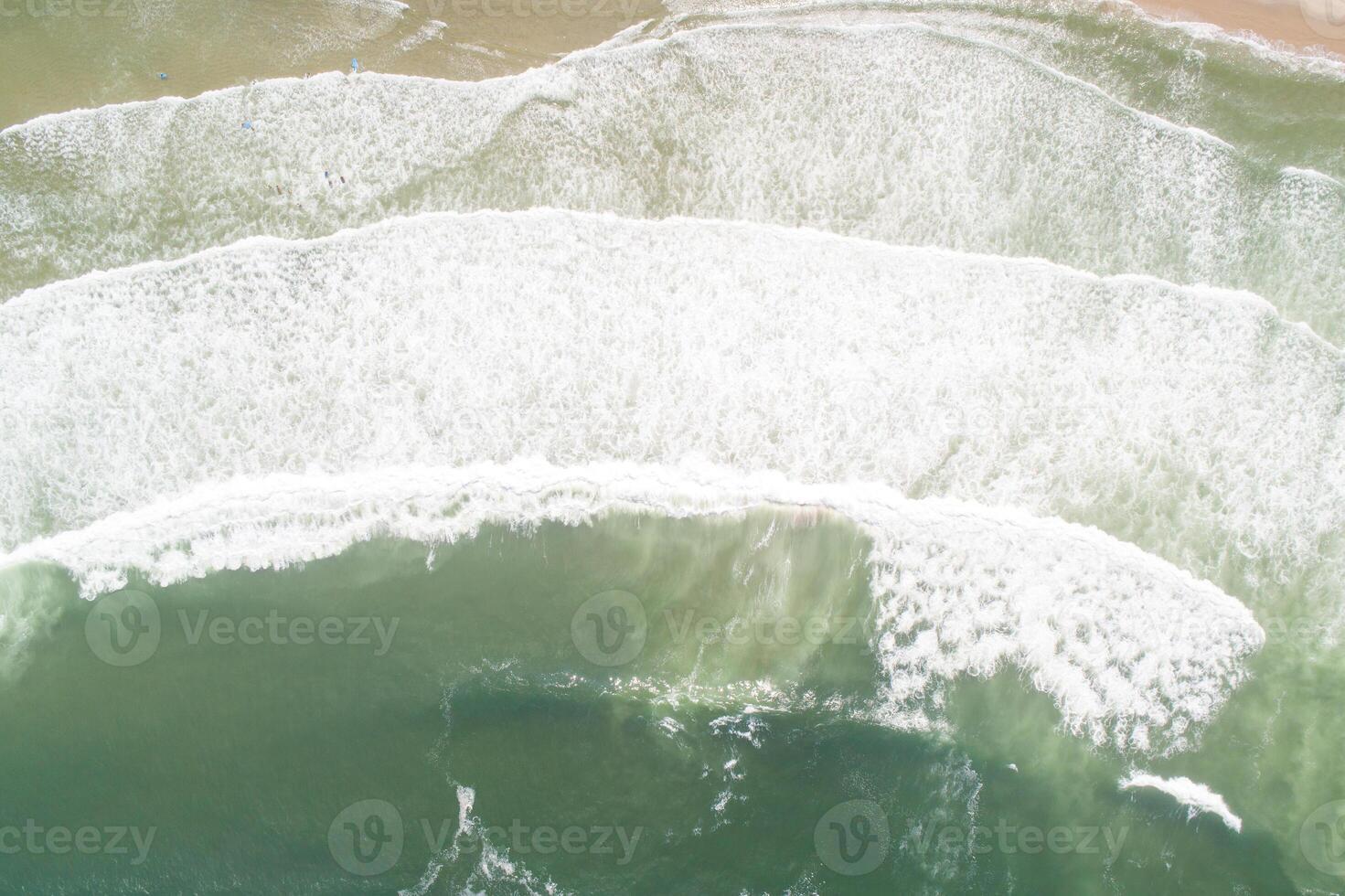 drone top down shot of a beautiful shoreline and ocean landscape photo