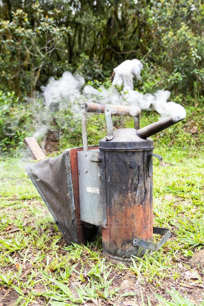 A small stove with a bag of charcoal on it photo