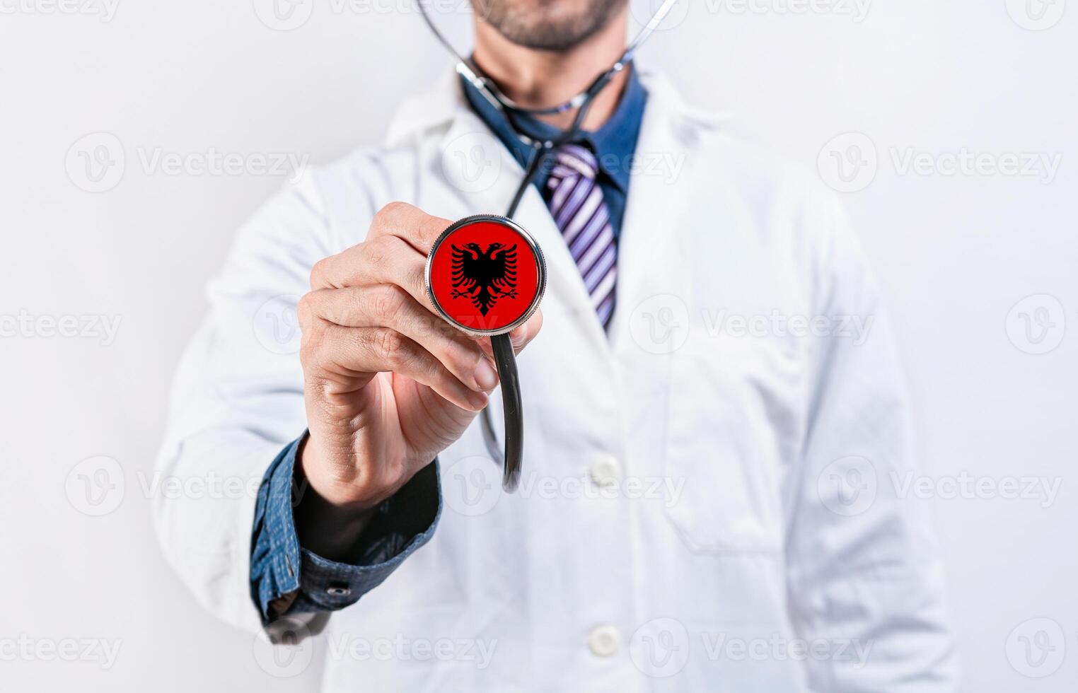 Albania healthcare system, doctor holding stethoscope. Albania health and medical insurance concept photo