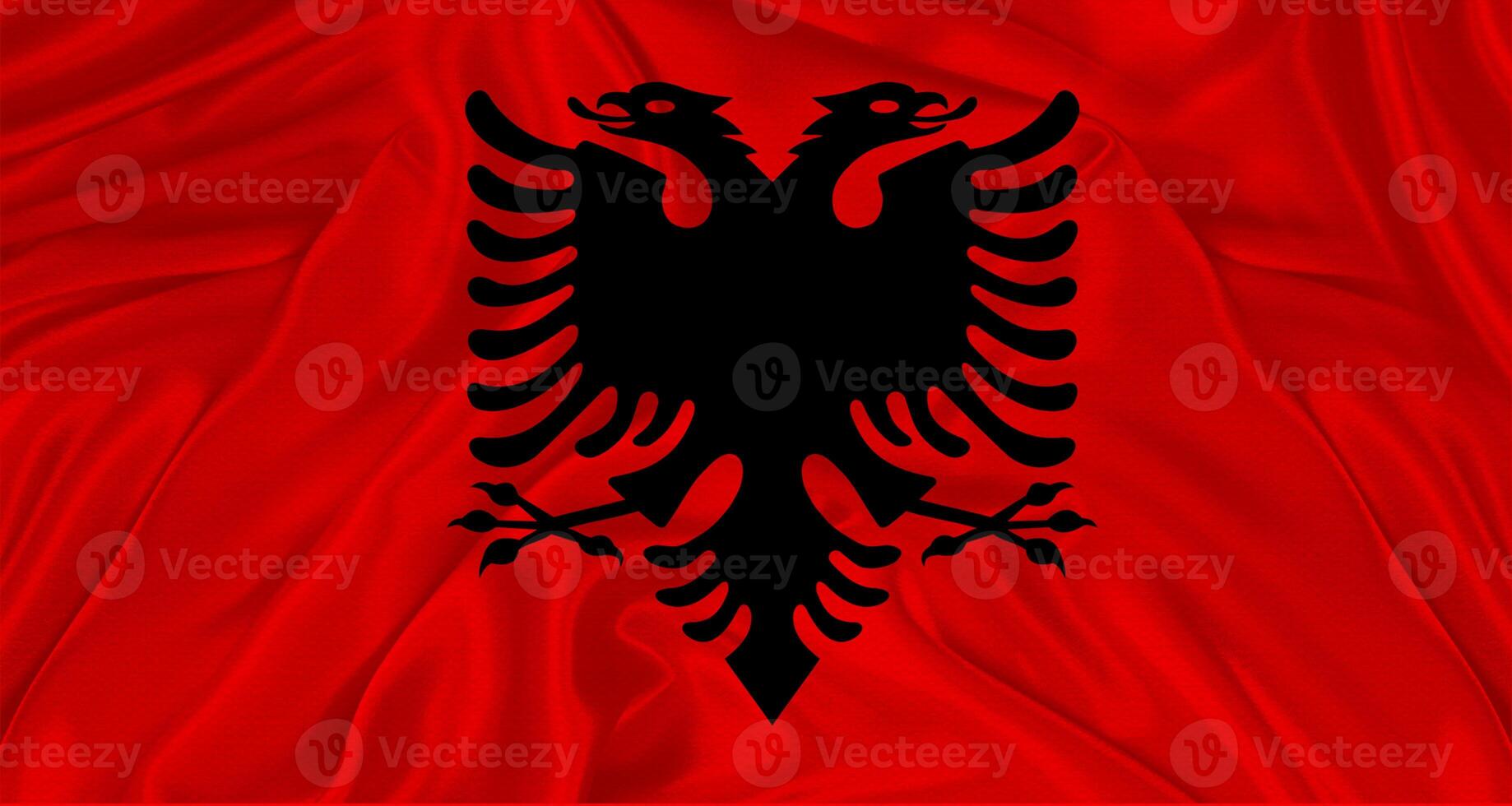 Flag of Albania with cloth texture. Close up of Albania flag waving photo