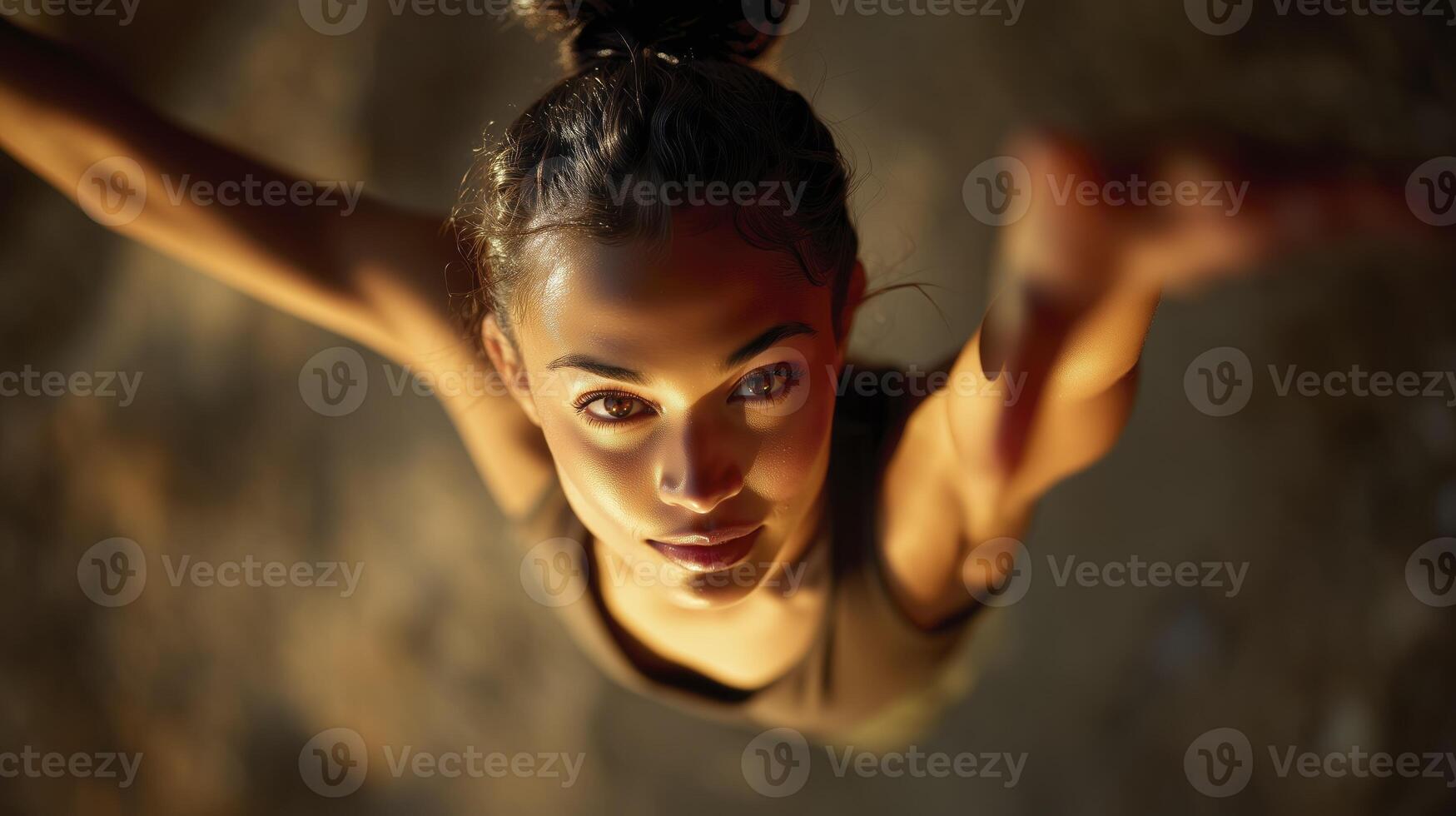 Top view of dancer reaching upward with strong expression photo