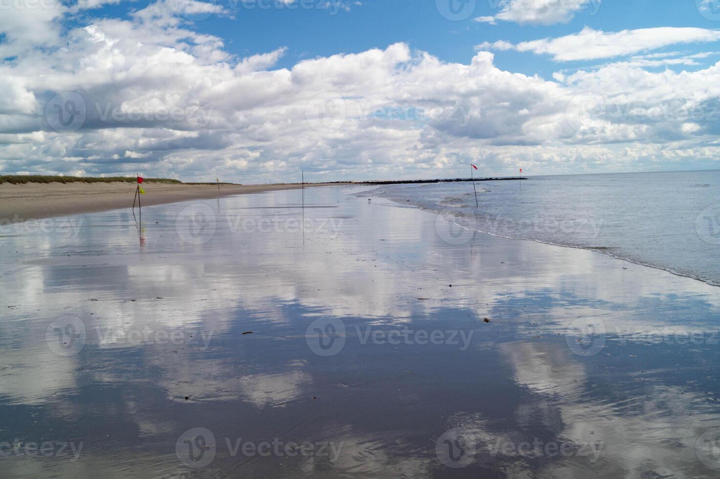 Cloud reflection on the North Sea photo