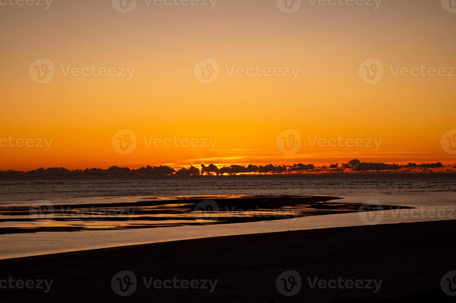 Sunset on the beach of Blavand photo