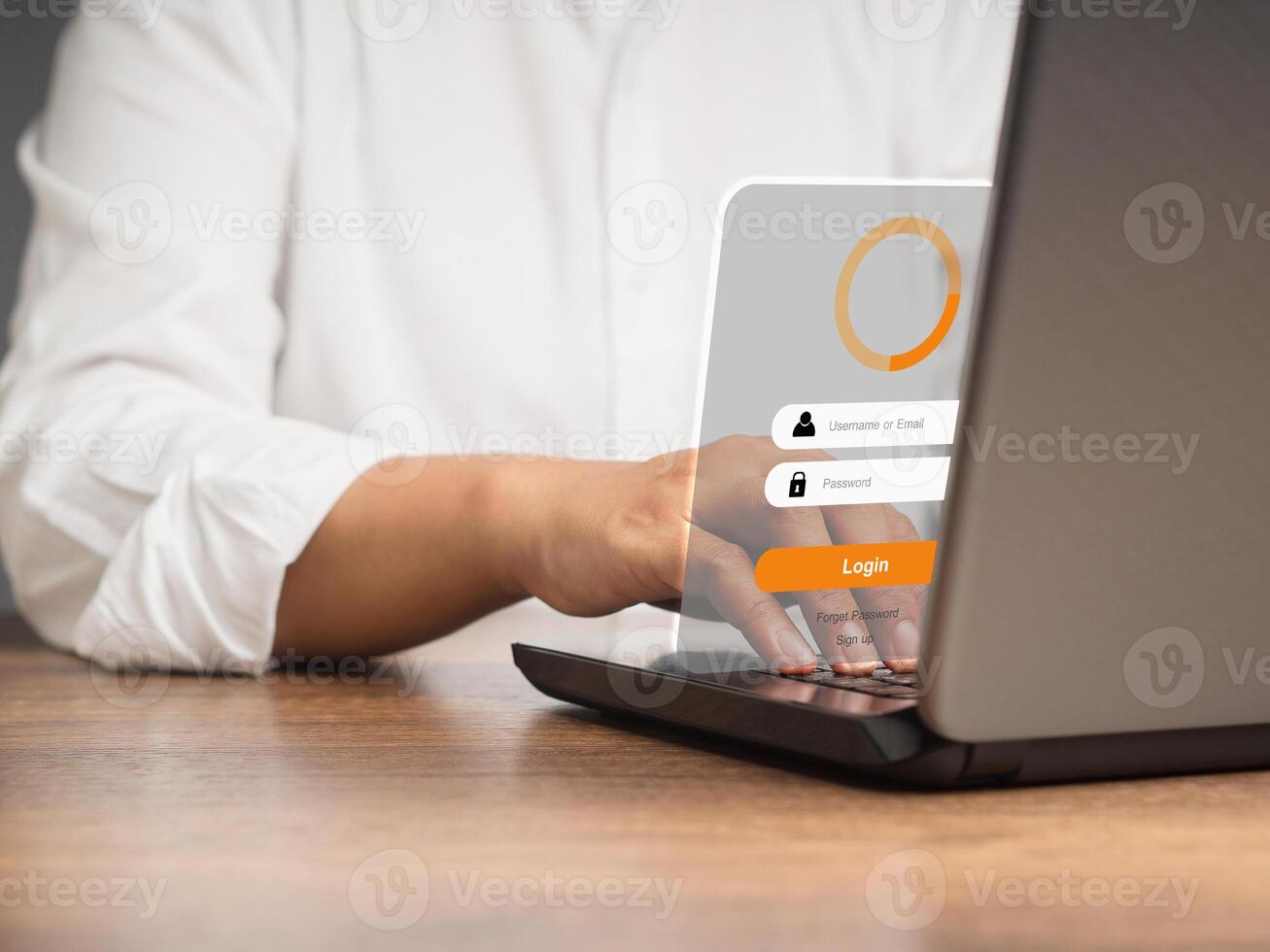 Businesswoman login to the network by username and password on the virtual screen while sitting at the table in the office photo