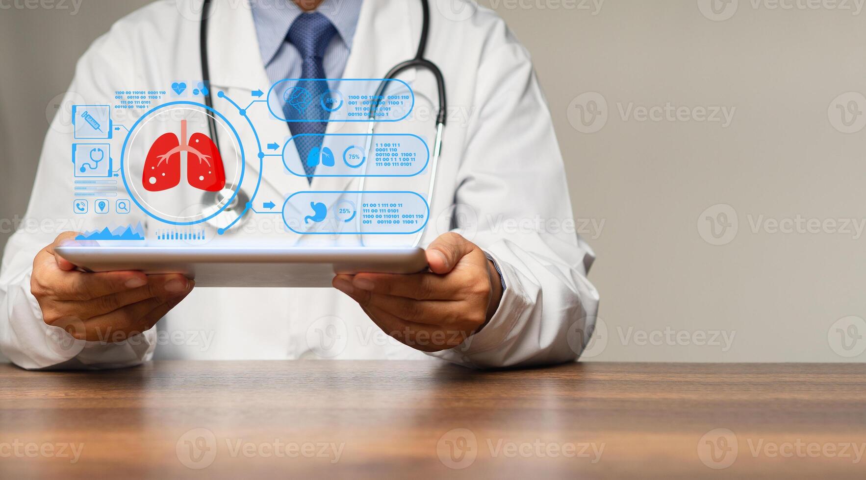Physician reads a lung examination report on a tablet virtual display while sitting in a hospital photo