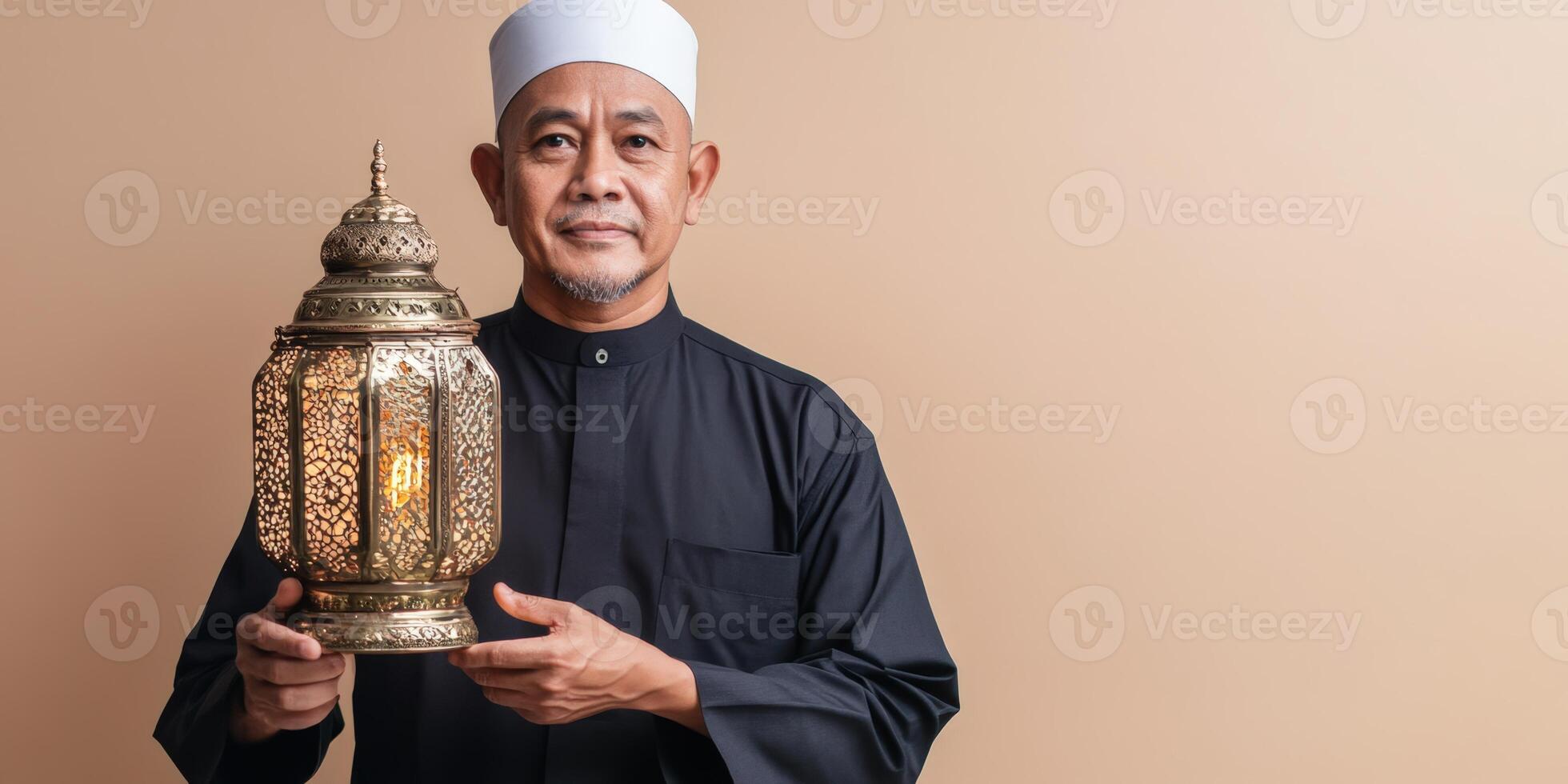 Muslim man holding a lantern. photo