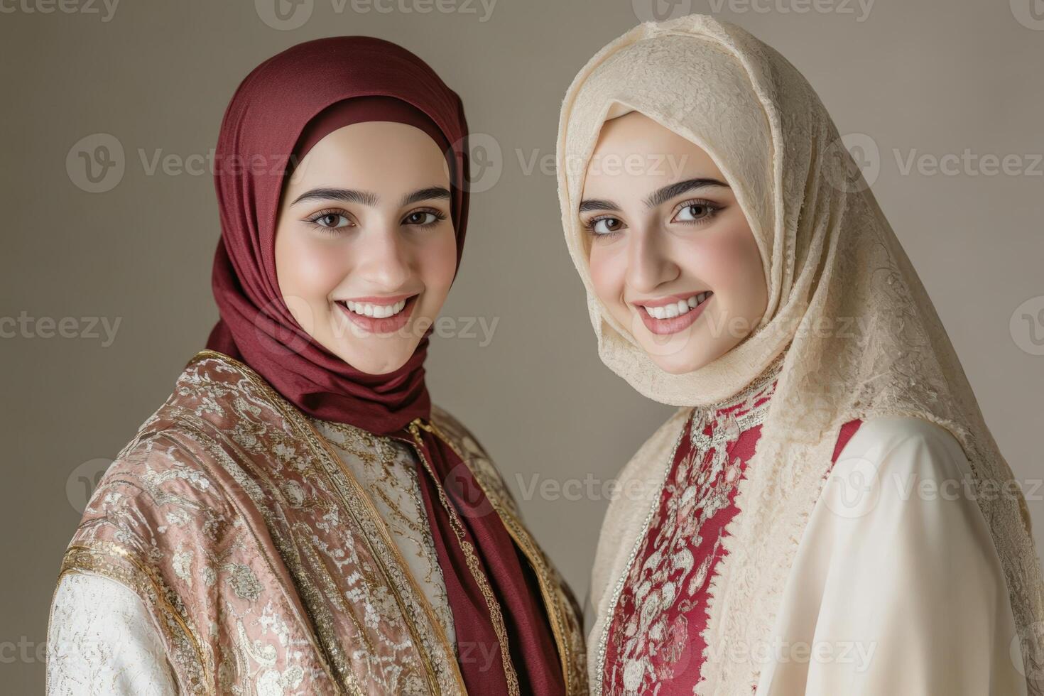 Two women wearing traditional clothing posing for the camera photo