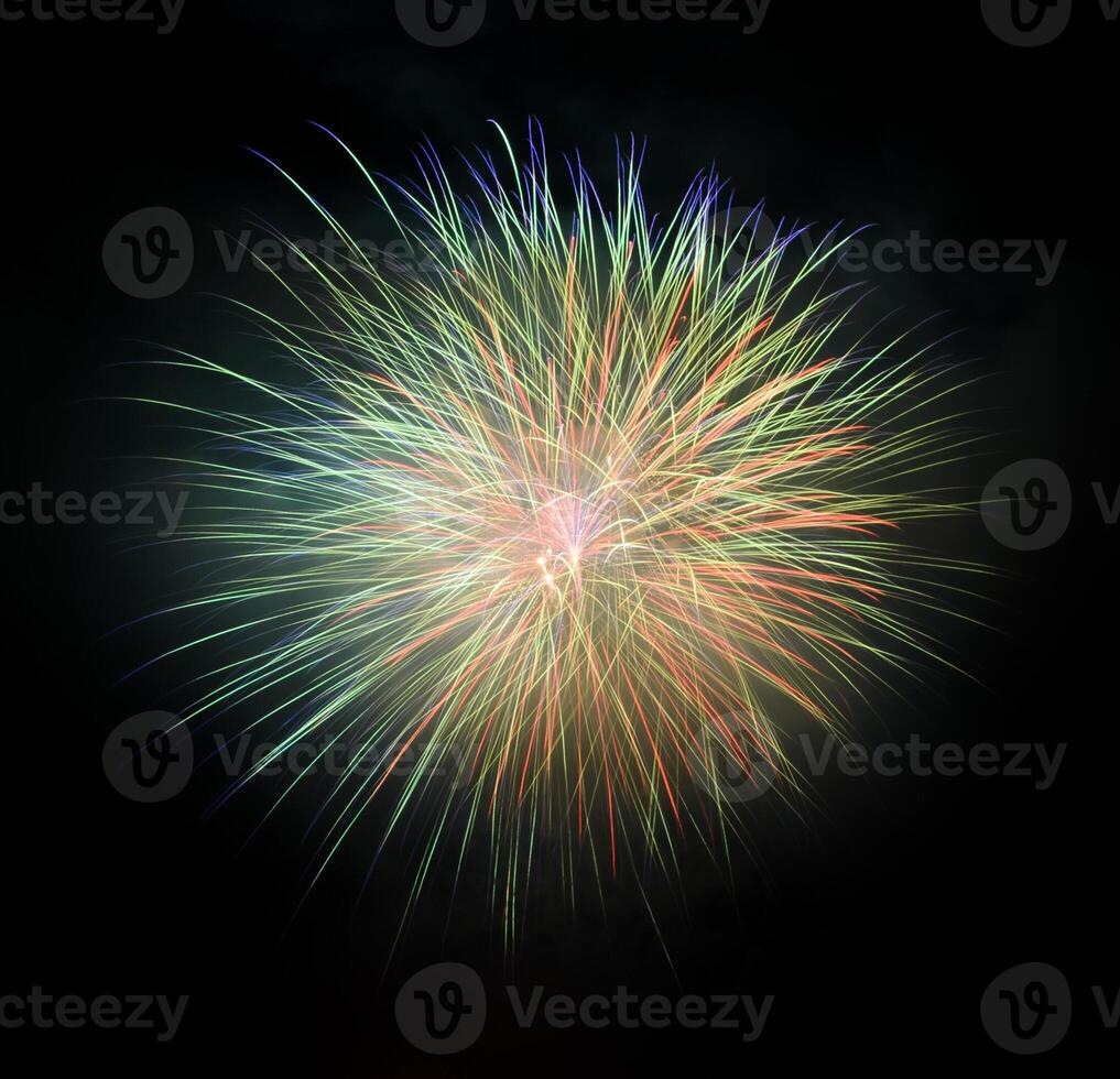 Colorful fireworks exploding black background photo