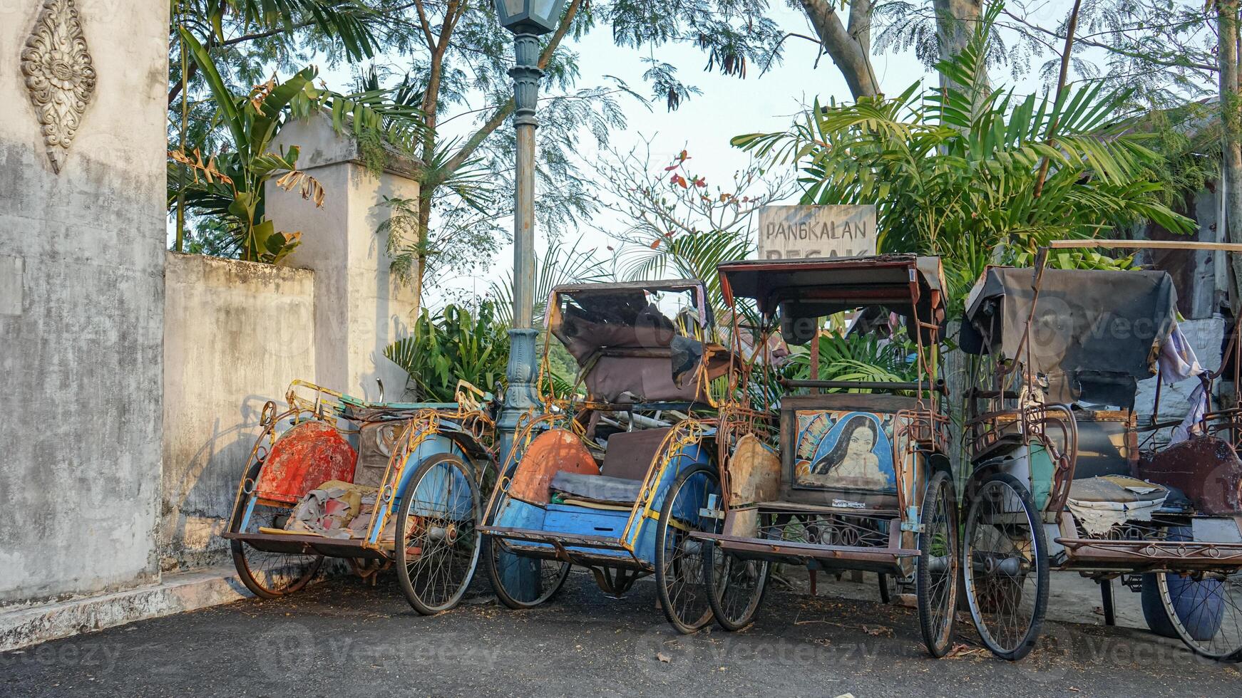 A rickshaw base on a sunny afternoon with a vintage feel in Yogyakarta, Indonesia photo