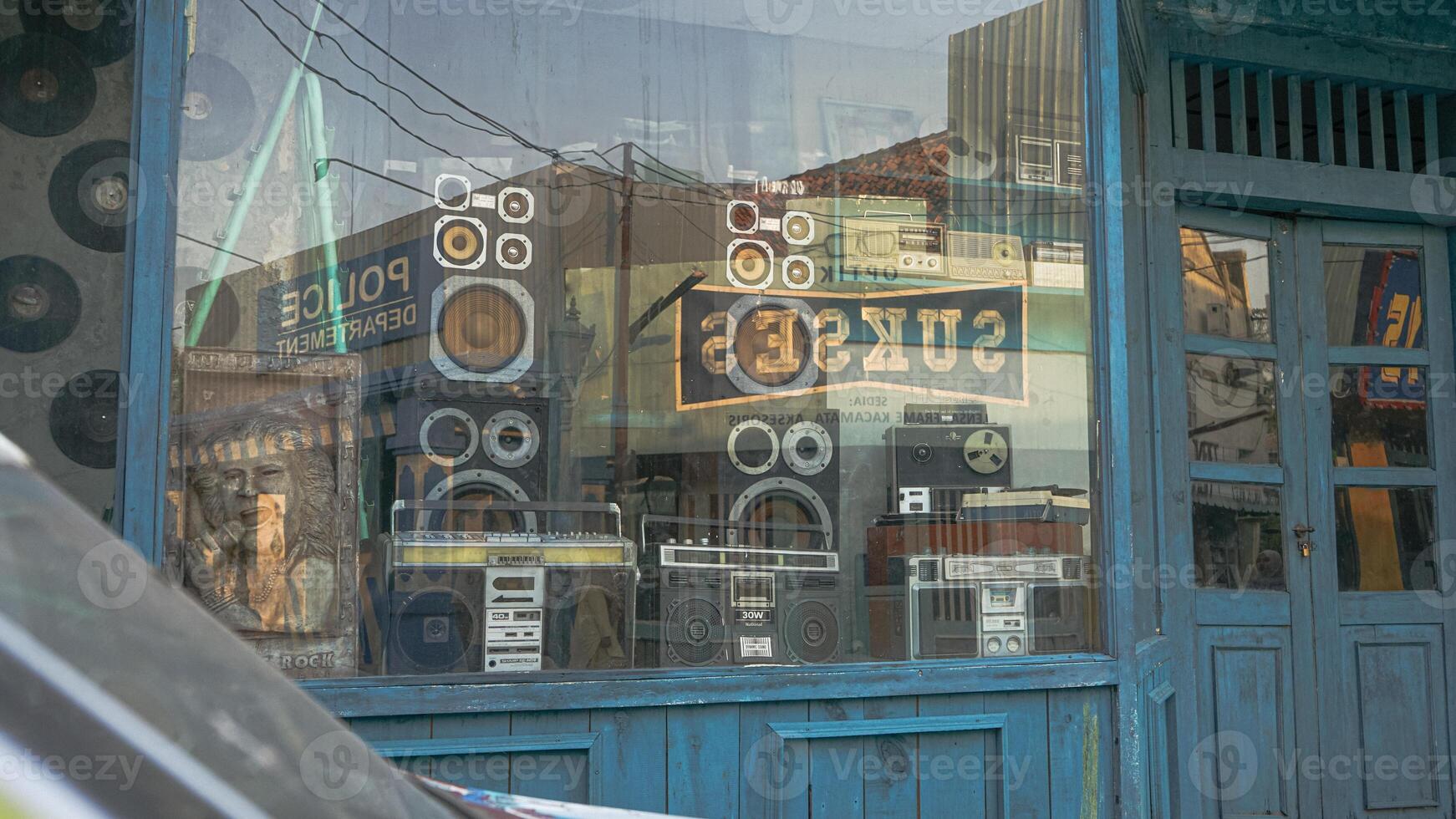 Retro Audio Shop Display with Boomboxes and Speakers photo