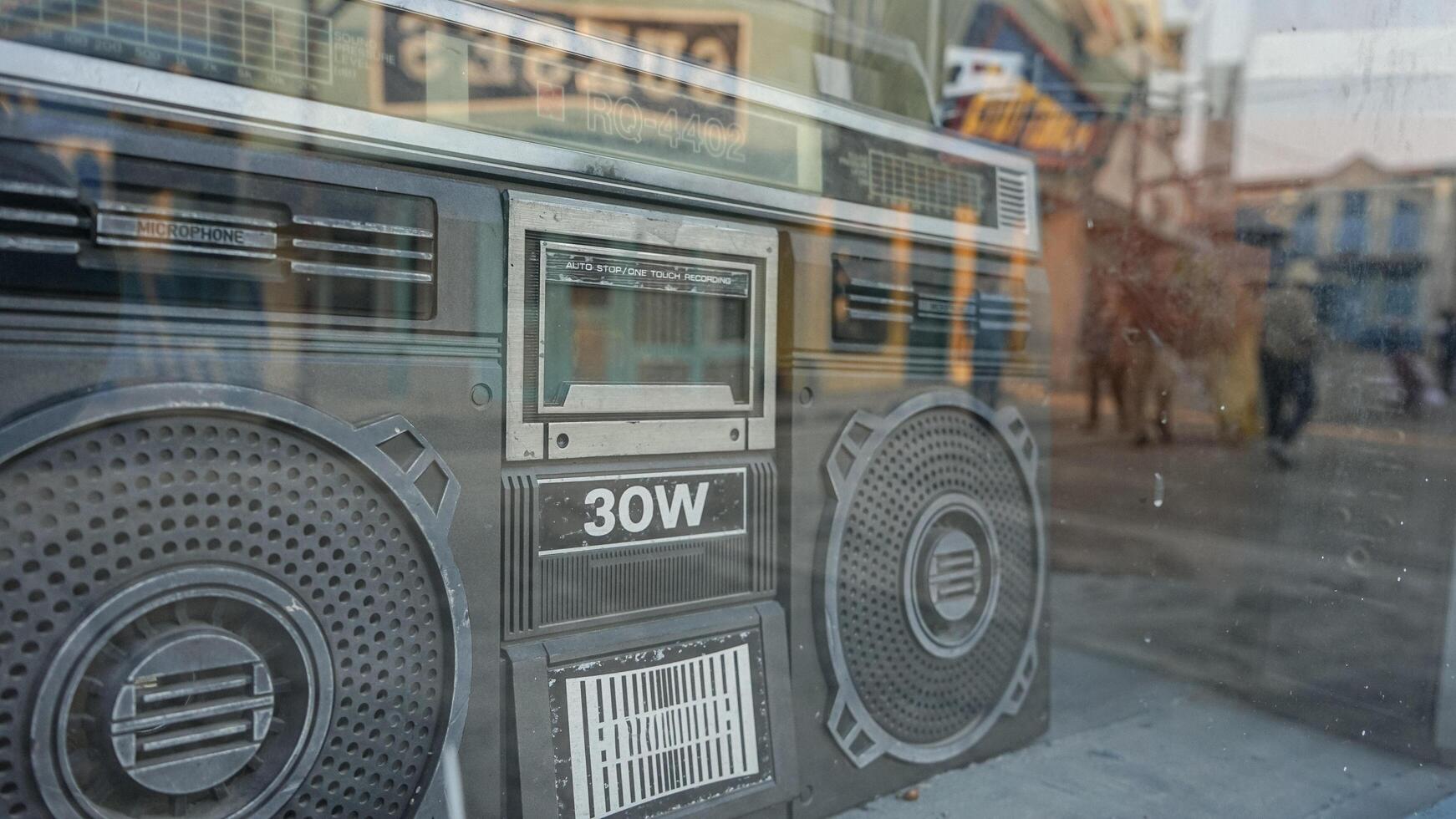 Vintage Boombox Reflected in a Store Window photo