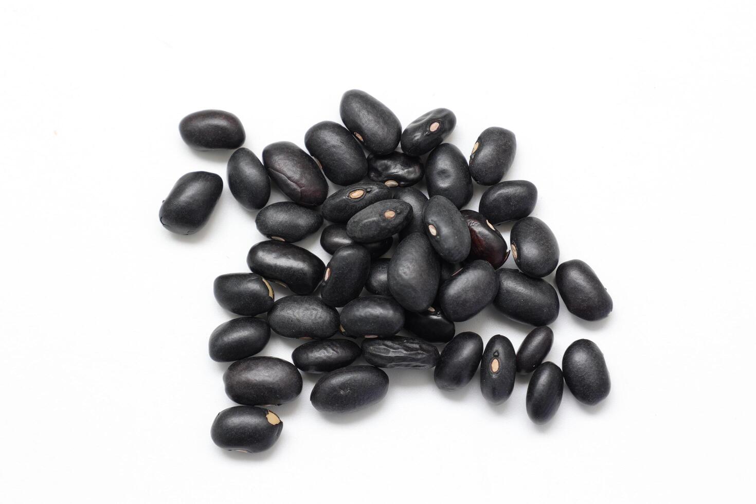 Black beans on white background, isolate of beans photo