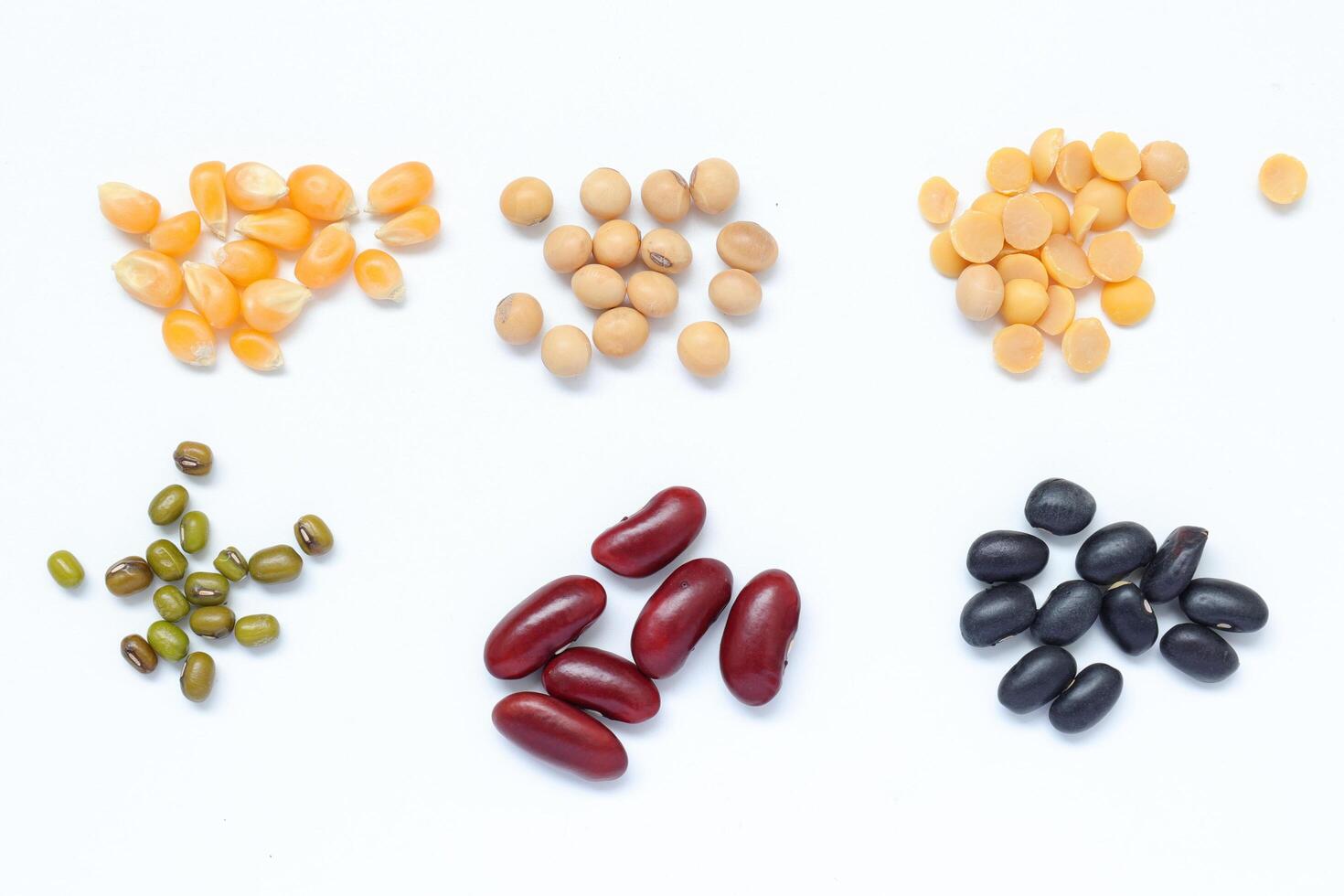 various types beans and beans on white background photo