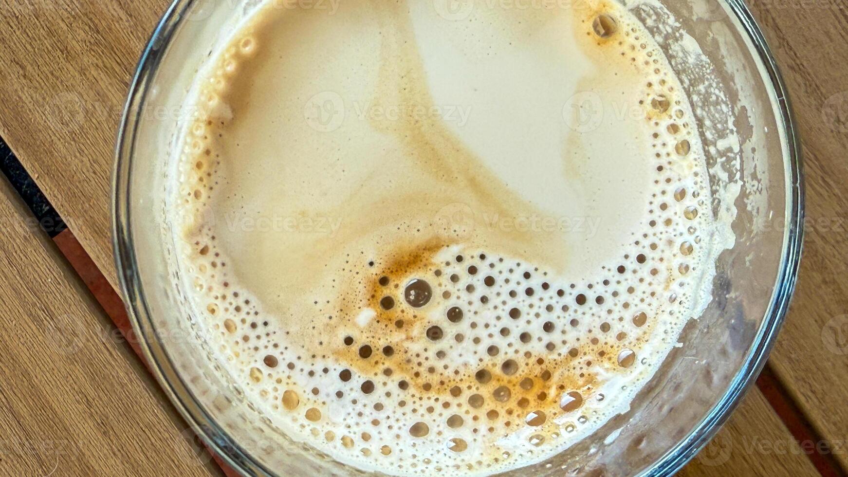 Frothy latte swirls invite cozy hygge vibes, celebrating Caffeine Awareness Month and International Coffee Day, aromatic brew indulgence photo
