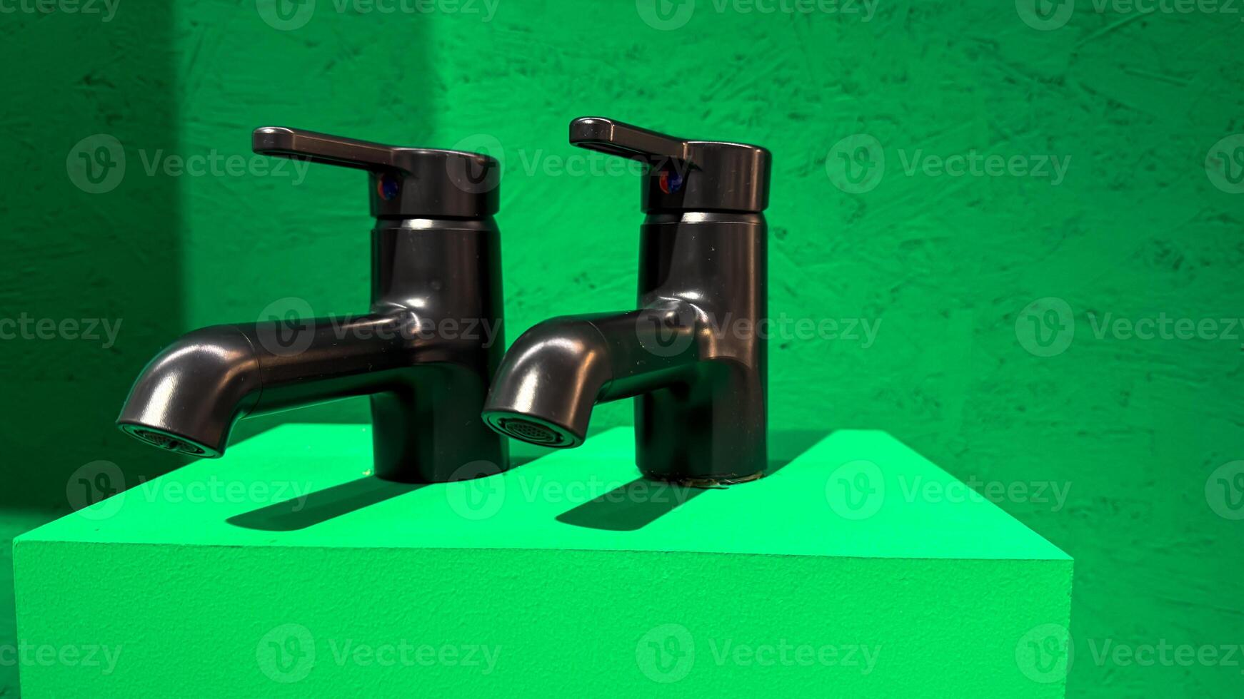 Twin chrome faucets gleaming against surreal emerald backdrop, plumbing artistry meeting eco futurism, perfect for World Water Day celebration photo