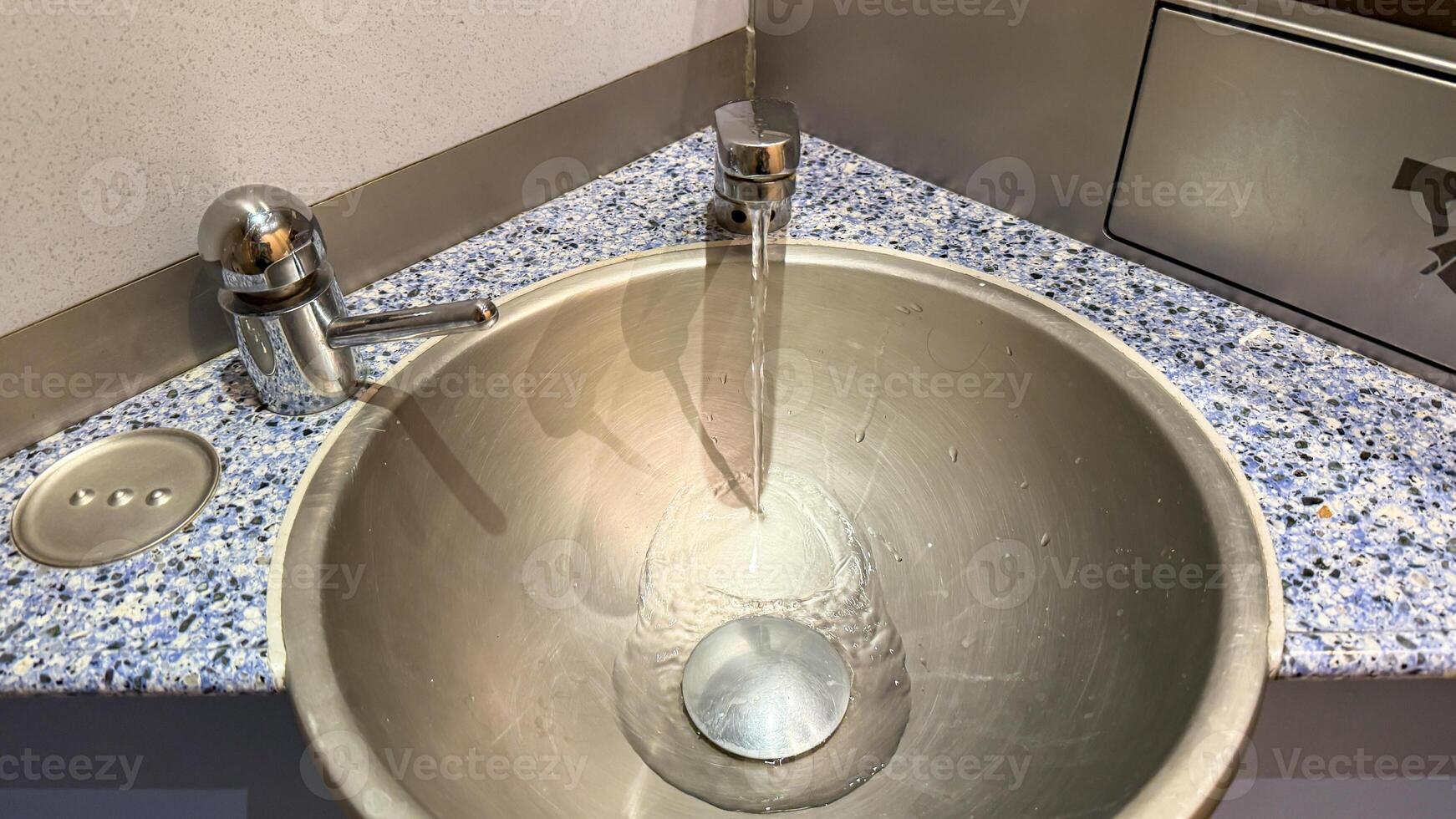 Sleek stainless steel basin, minimalist zen design celebrates Hygge tranquility and World Plumbing Days celebration of hidden infrastructure art photo