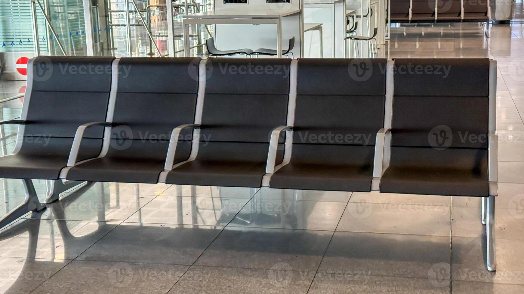 Vacant airport seating whispers tales of transient souls and restless wanderers, resonating with World Tourism Day and Jet Lag Awareness Week photo