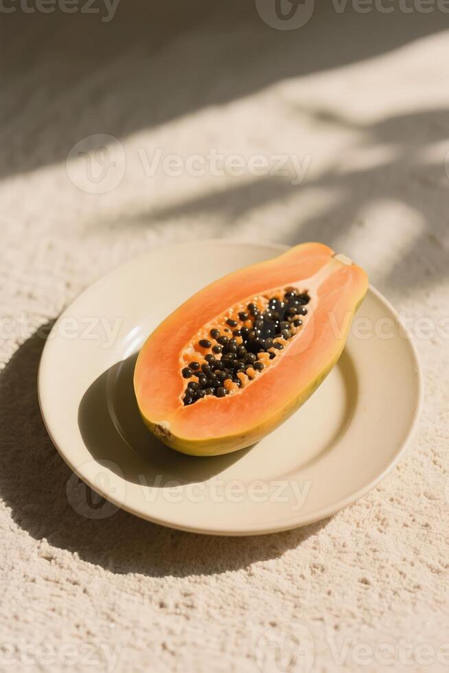 A papaya is on a white plate photo