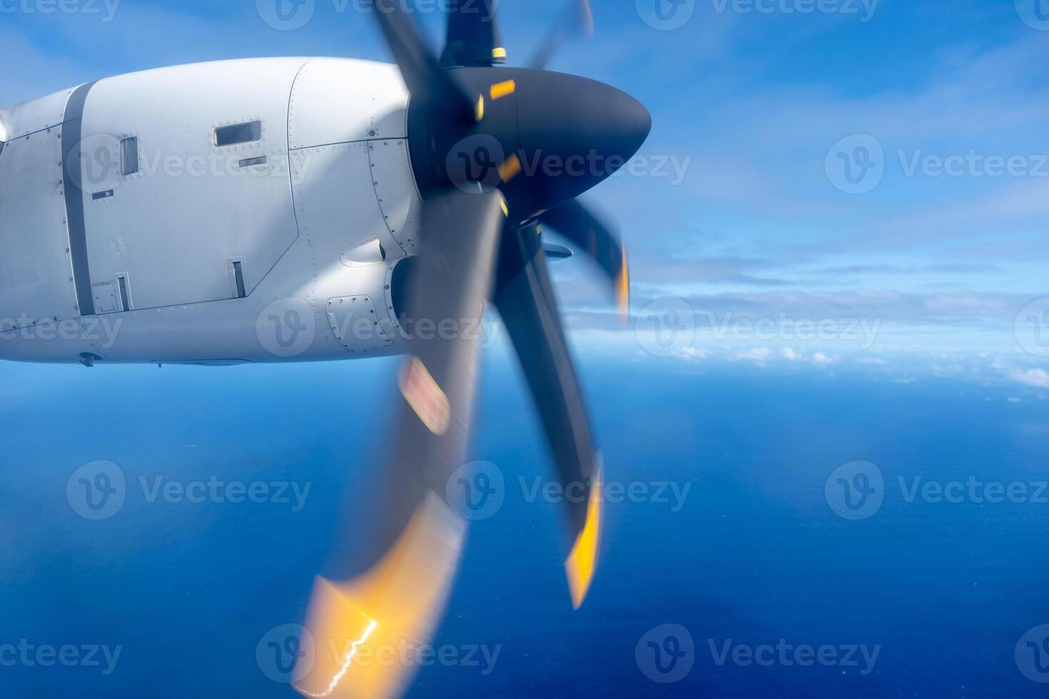 Aerial view of the Pacific Ocean with a spinning propeller photo