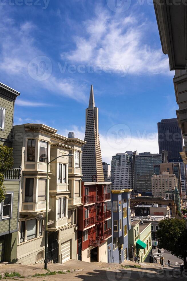 Steep street view with downtown skyline in San Francisco, USA photo