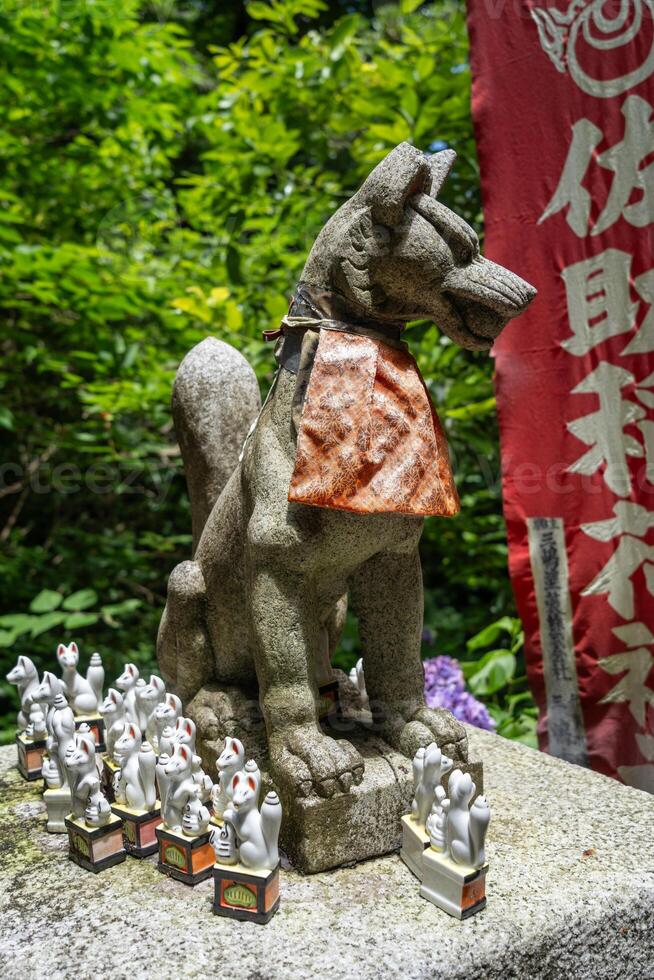 Inari fox statue at Sasuke Inari-jinja in Kamakura, Japan photo