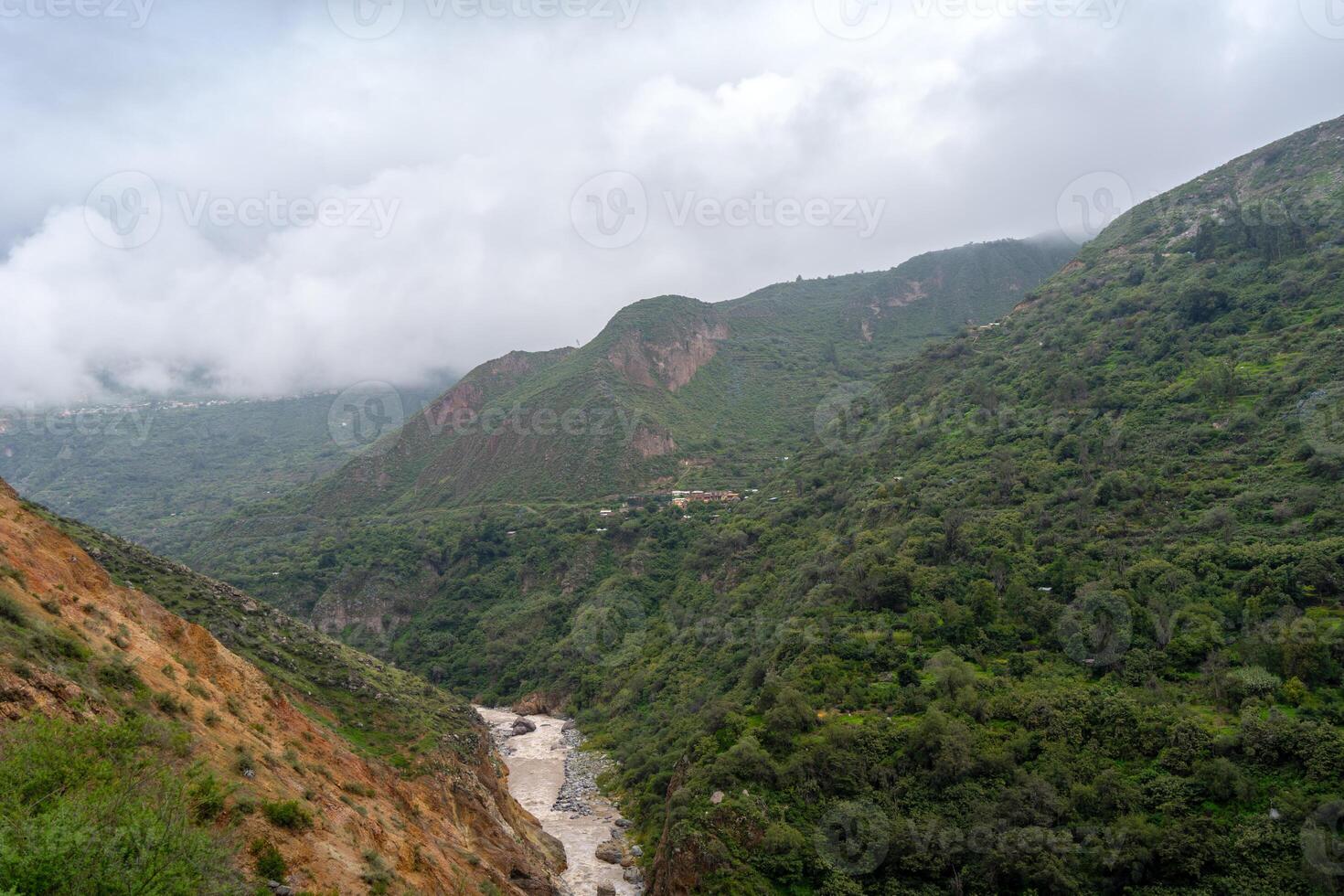 Colca Canyon and river in the mist and cloud, Peru photo