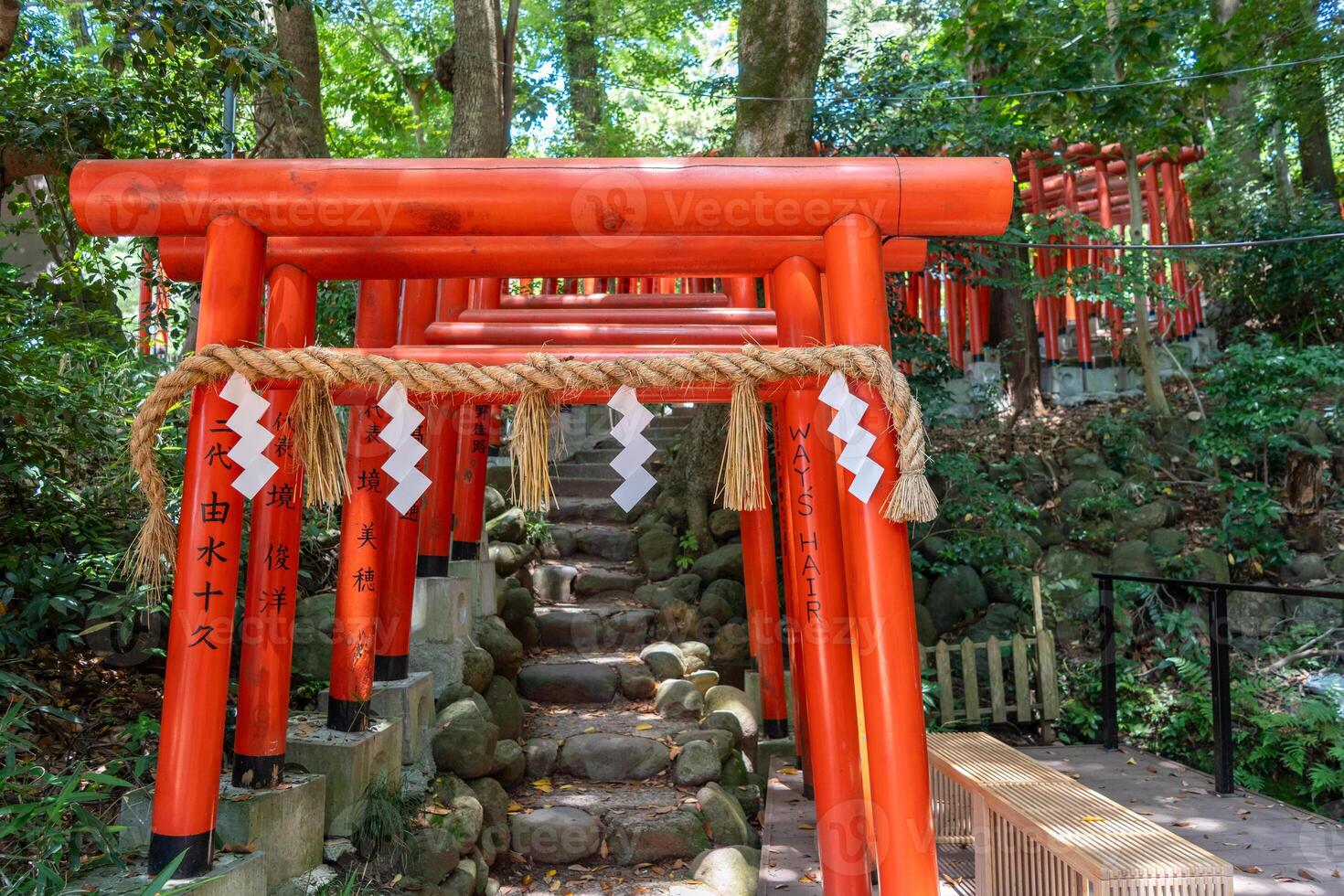 Red torii gates of Ishiura Shrine in Kanazawa, Japan photo