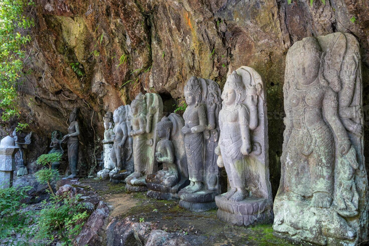Buddhist statue group at Mitaki-Dera temple in Hiroshima, Japan photo